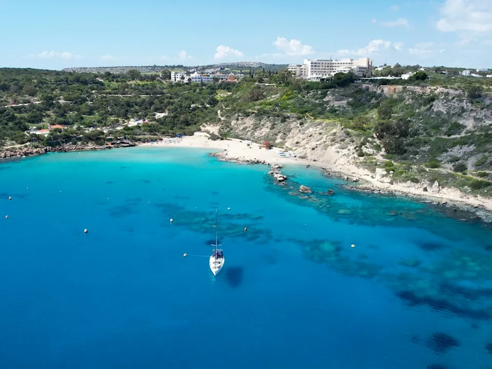 Konnos Bay near Protaras, a sandy cove with deep blue water below green hills