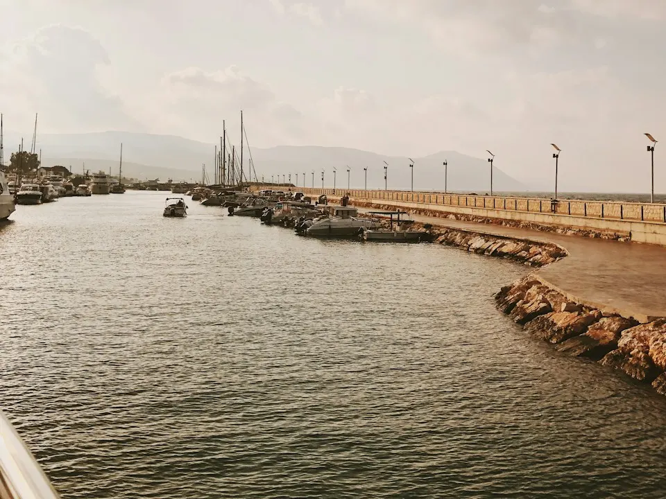 Boats in Latchi harbour near Polis, with the Akamas hills behind
