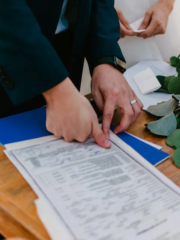 Couple signing their marriage certificate at a civil ceremony